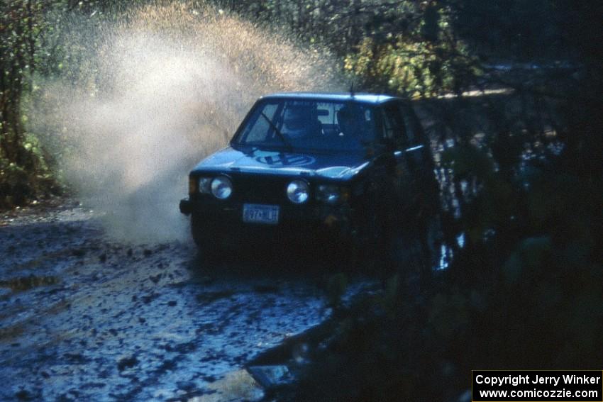 Aaron Hatz / Brendan Higgins hit the same puddle at speed in their VW GTI with more fortunate results.