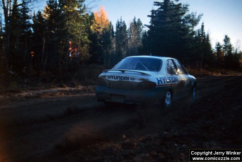 Paul Choinere / John Buffum throw rooster-tails at the start of Menge Creek 2 in their Hyundai Elantra.