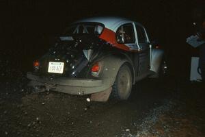 Reny Villemure / Mike Villemure blast out of the start of a night stage in their VW Beetle.