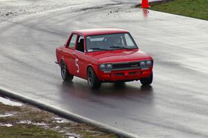 A vintage Datsun 510 tests out the new track in the rain.