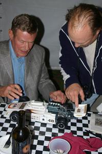 Bobby Unser signs the wing of a model of his 1974 Indy 500 Eagle. (1)