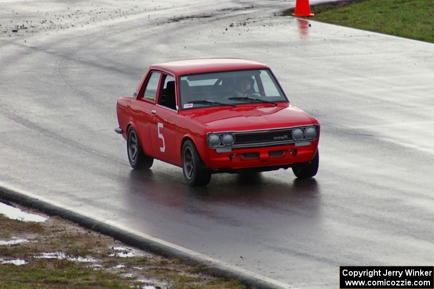 A vintage Datsun 510 tests out the new track in the rain.