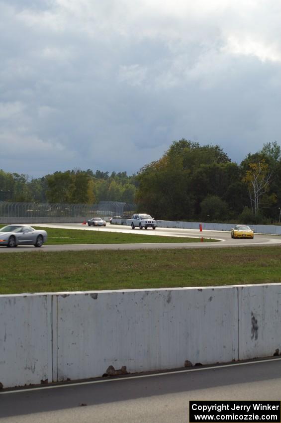 Vehicles driving through the new turns 10 and 11