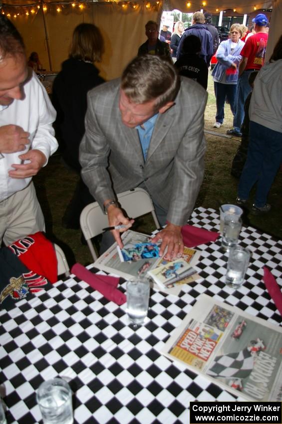 Bobby Unser signs autographs