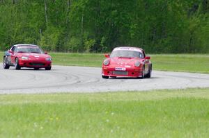 Shannon Ivey's ITE Porsche 911SC and Tom Kraft's Spec Miata Mazda Miata