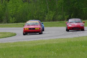 Howie Fairbanks' ITB VW Scirocco, Tom Kraft's Spec Miata Mazda Miata and an unidentified Spec Miata Mazda Miata