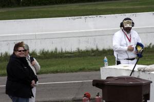 Julie Hammons, ??? and Jim Gillen work a windy corner 13