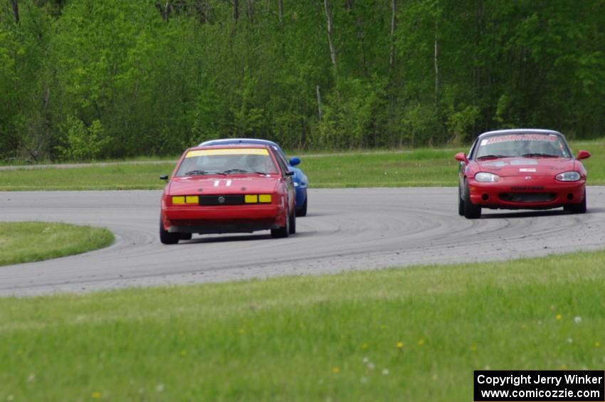 Howie Fairbanks' ITB VW Scirocco, Tom Kraft's Spec Miata Mazda Miata and an unidentified Spec Miata Mazda Miata