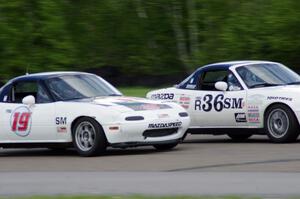 (19) Justin Elder's Spec Miata Mazda Miata and (36) Craig Silver's Spec Miata Mazda Miata