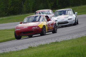 Greg Youngdahl's ITA/Spec Miata Mazda Miata, Justin Elder's Spec Miata Mazda Miata and Lon Blaser's Spec Miata Mazda Miata