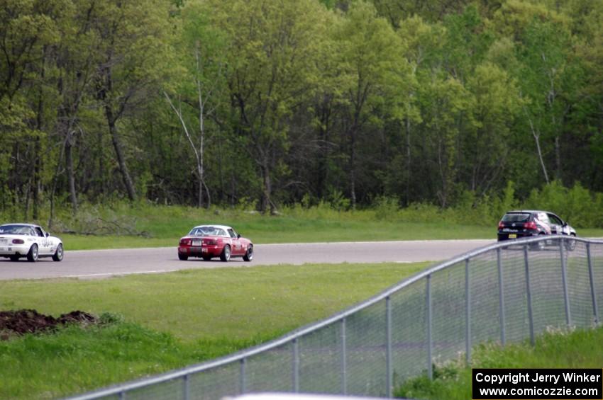 David Daly's SCC VW Rabbit, Lon Blaser's Spec Miata Mazda Miata and Craig Silver's Spec Miata Mazda Miata