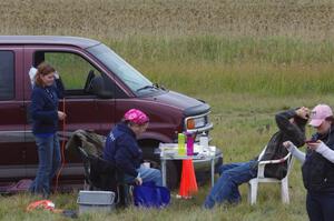 Carrie Carlson, Mary Utecht, ??? and Kathy Freund take a break at the timing area