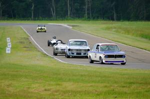 Tom Moran's BMW 2002, Greg Meyers' Dodge Dart, Mark Brandow's MGA, John Hertsgaard'sFormula Junior and John Hagen's Triumph TR-4