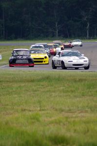 Ray Yergler's ITA Mazda Miata, Terry Orr's GTL Austin Mini-Cooper and Tim Homes' E Production Datsun 240Z, etc.