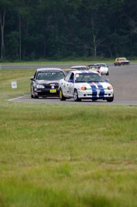 John Glowaski's ITA Dodge Neon ACR and David Daly's SCC VW Rabbit, etc.