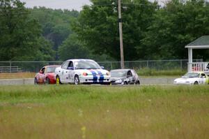 John Glowaski's ITA Dodge Neon ACR, Greg Youngdahl's Spec Mazda Miata, David Daly's SCC VW Rabbit and Dan Corgard's Spec Miata