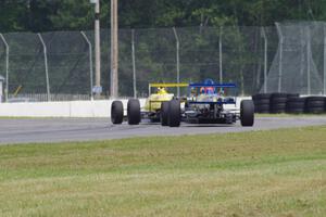 Steve Thomson's Van Diemen RF02 and Chris Miller's Van Diemen RF06 Formula Continentals at turn 6