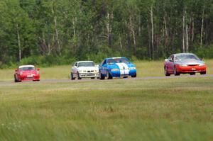 Tom Fuehrer's STO Ford Mustang, Mark Utecht's ITE Ford Mustang, Rick Iverson's ITE BMW M3 and Shannon Ivey's ITE Porsche 911SC