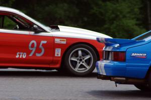 Mark Utecht's ITE Ford Mustang passes Tom Fuehrer's STO Ford Mustang