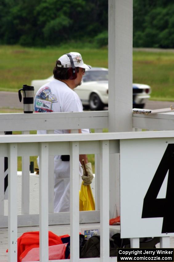 Dave Johnson works corner 4 as Brian Kennedy's Ford Shelby GT-350 goes past