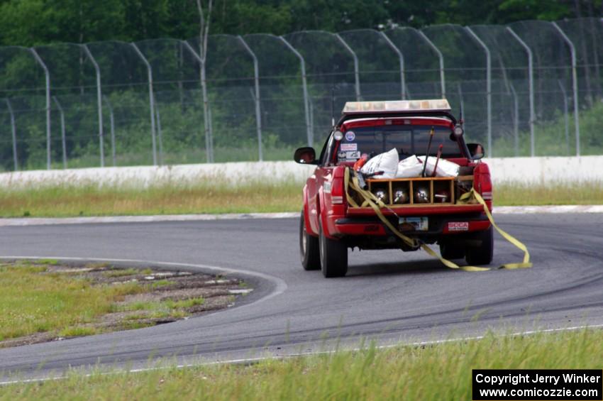 Jim Anderson's Dodge Ram Pickup goes onto the track for an emergency