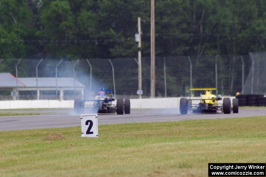 Chris Miller's Van Diemen RF06 and Steve Thomson's Van Diemen RF02 Formula Continentals brake hard for turn 12