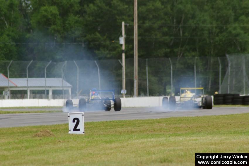 Chris Miller's Van Diemen RF06 and Steve Thomson's Van Diemen RF02 Formula Continentals brake hard for turn 12