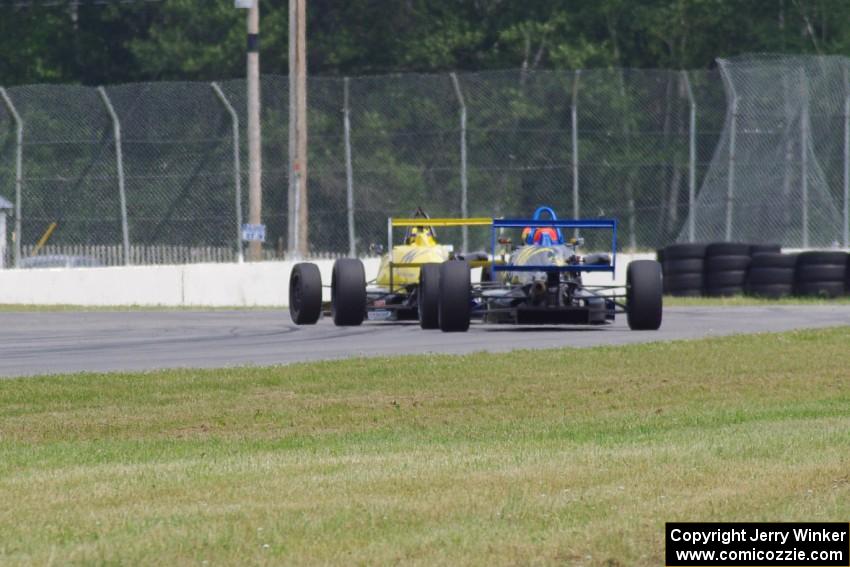 Steve Thomson's Van Diemen RF02 and Chris Miller's Van Diemen RF06 Formula Continentals at turn 6