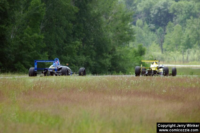 Steve Thomson's Van Diemen RF02 and Chris Miller's Van Diemen RF06 Formula Continentals at turn 6