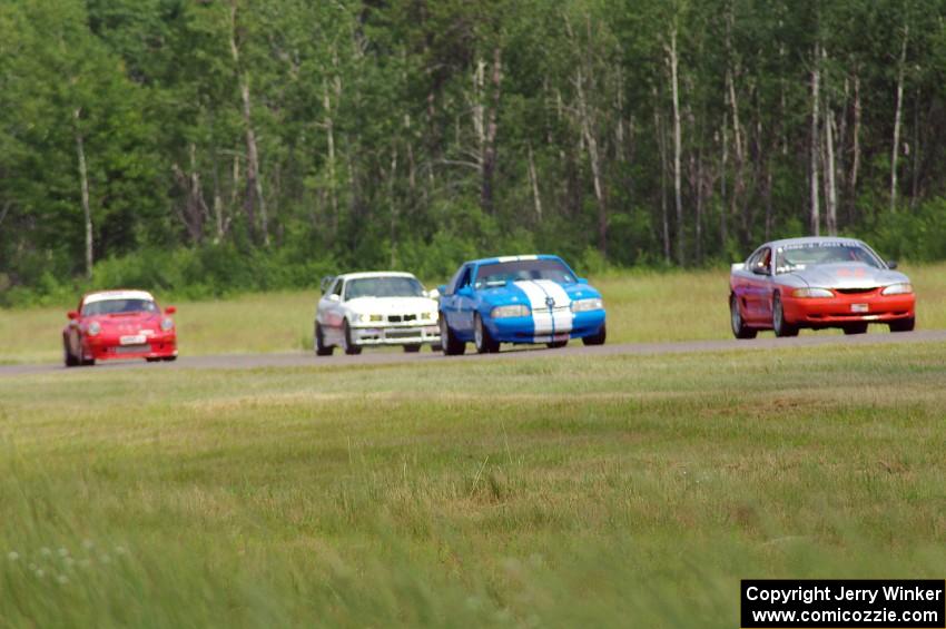 Tom Fuehrer's STO Ford Mustang, Mark Utecht's ITE Ford Mustang, Rick Iverson's ITE BMW M3 and Shannon Ivey's ITE Porsche 911SC