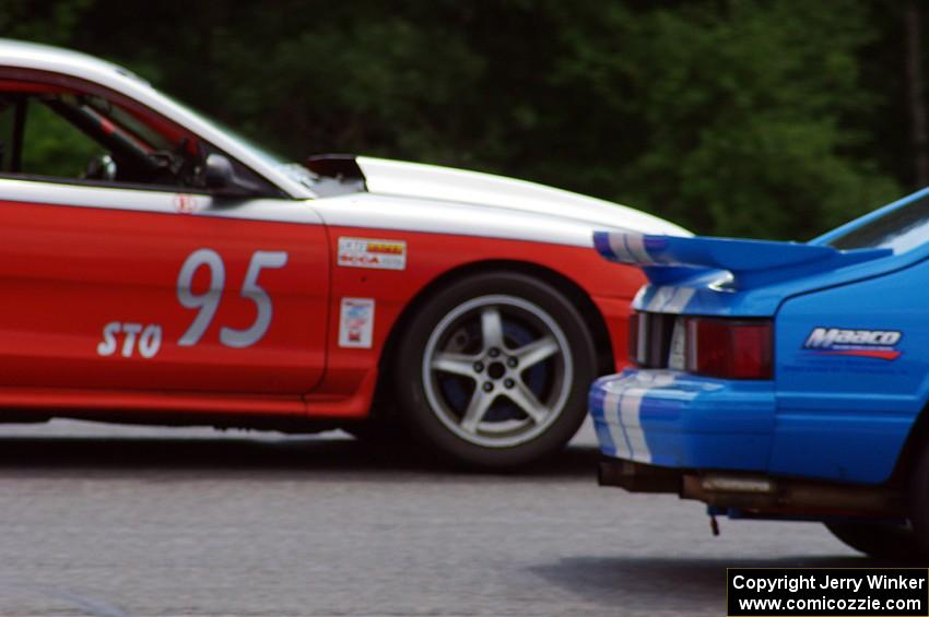 Mark Utecht's ITE Ford Mustang passes Tom Fuehrer's STO Ford Mustang