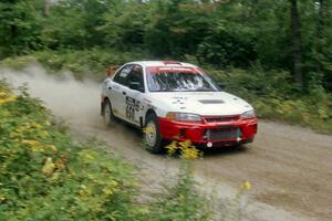 Mark Adkins / Jeff Aitkins Mitsubishi Lancer Evo IV on Halverson Lake, SS1.