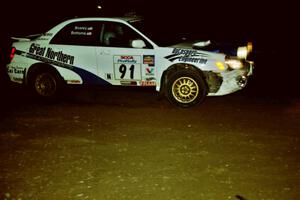 Jonathan Bottoms / Carolyn Bosley Subaru WRX at night on SS8, Flying Finnish.