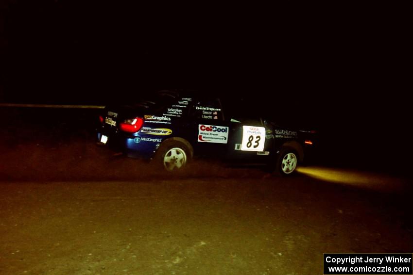 Mark Utecht / Jeff Secor Subaru WRX at night on SS8, Flying Finnish.