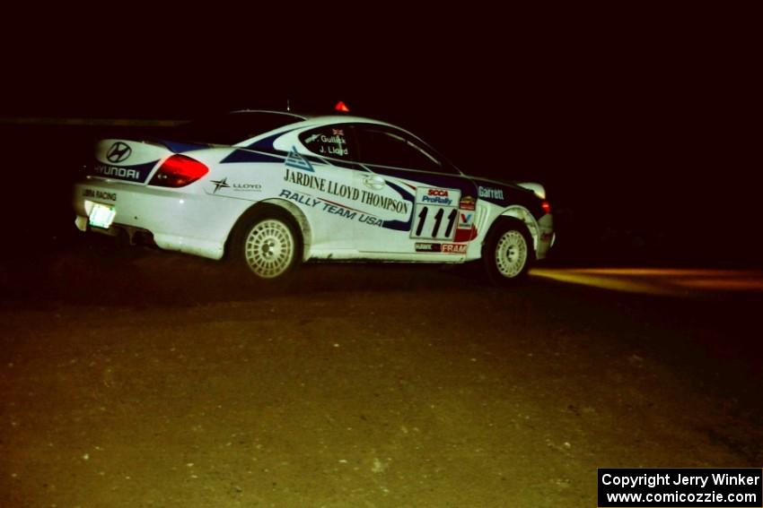 John Lloyd / Pauline Gullick Hyundai Tiburon at night on SS8, Flying Finnish.