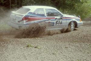 Chris Huntington / Doug Bradford Mazda 323GTX at the SS9 (Heart Lake) spectator area.