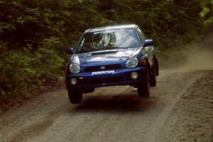 Mark Utecht / Jeff Secor Subaru WRX catches air on a jump on SS13, Indian Creek.