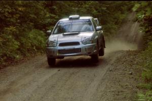 Peter Workum / Alex Gelsomino Subaru WRX STi catches air on a jump on SS13, Indian Creek.