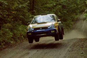 Pat Richard / Nathalie Richard Subaru WRX catches air on a jump on SS13, Indian Creek.