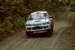 Chris Gilligan / Joe Petersen Mitsubishi Lancer Evo IV catches air on a jump on SS13, Indian Creek.