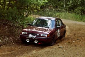 Ben Hanka / John Nordlie Mazda Protege at a 90-right on SS13, Indian Creek.