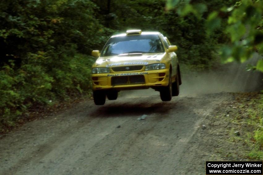 Lauchlin O'Sullivan / Scott Putnam Subaru Impreza catches air on a jump on SS13, Indian Creek.