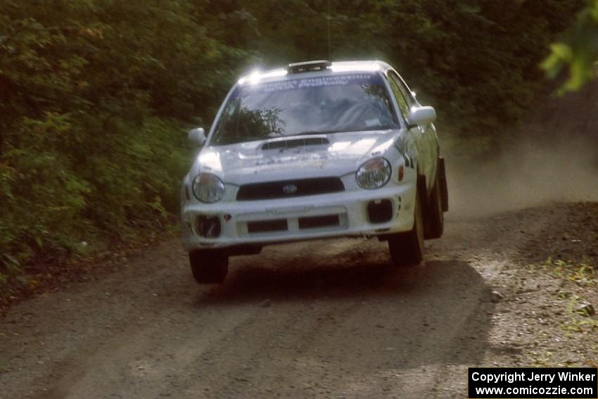 Jonathan Bottoms / Carolyn Bosley Subaru WRX catches air on a jump on SS13, Indian Creek.