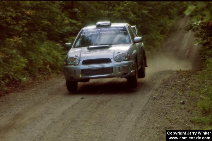 Peter Workum / Alex Gelsomino Subaru WRX STi catches air on a jump on SS13, Indian Creek.