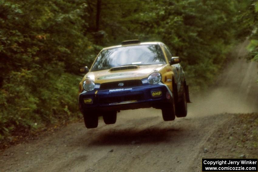 Pat Richard / Nathalie Richard Subaru WRX catches air on a jump on SS13, Indian Creek.