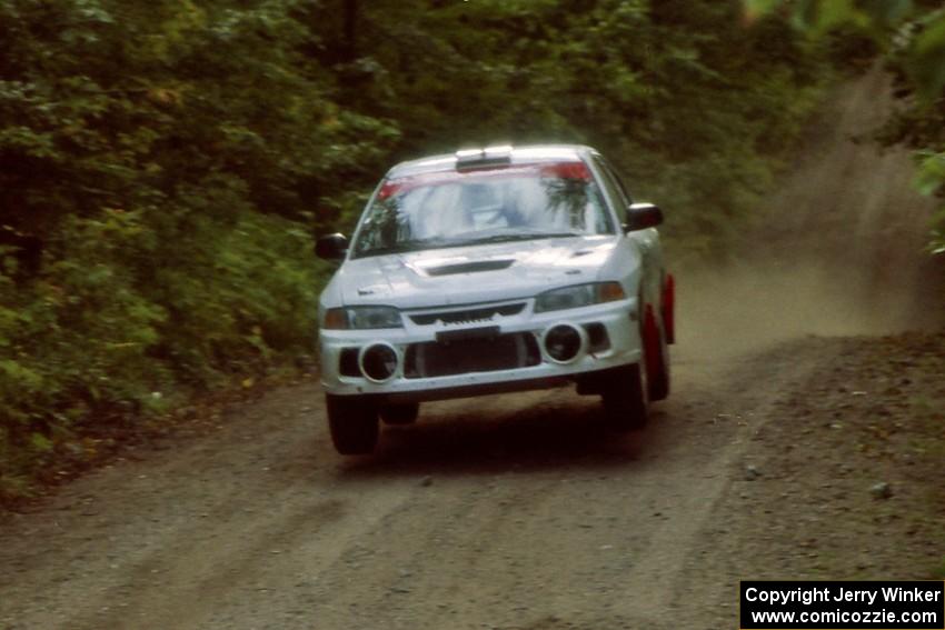 Chris Gilligan / Joe Petersen Mitsubishi Lancer Evo IV catches air on a jump on SS13, Indian Creek.