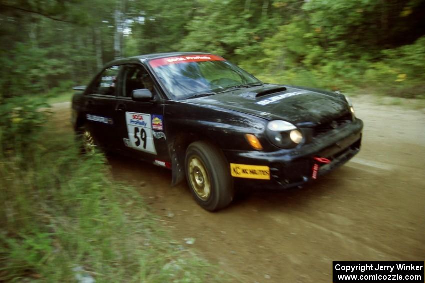 Pat Moro / Neil Smith Subaru WRX at a 90-right on SS13, Indian Creek.