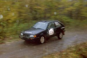 Tom Ottey / Pam McGarvey Mazda 323GTX on SS8, Gratiot Lake.