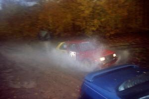 Carl Seidel / Eric Iverson VW Golf passes the waterlogged Erick Murray / Barry Ptak Subaru Legacy on SS8, Gratiot Lake.