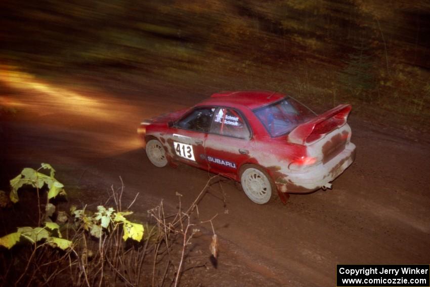 Erik Schmidt / Larry Schmidt Subaru Impreza at the first corner of SS15, Gratiot Lake II.